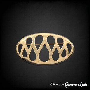 Vintage Monet Openwork Oval Shaped Teardrop Cut Out Gold Tone Brooch